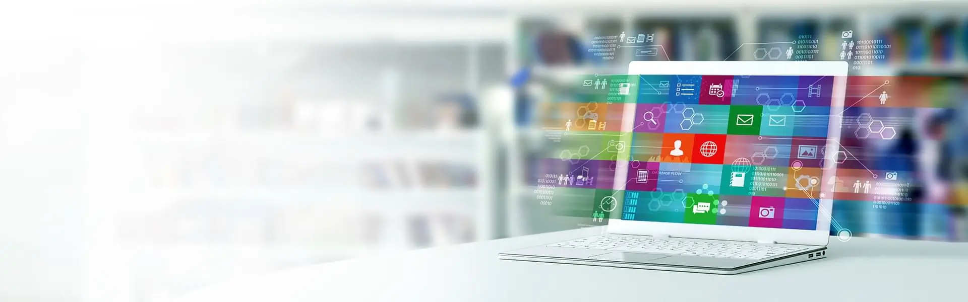 laptop with app icons filling the screen and extending beyond the screen, floating in the air.